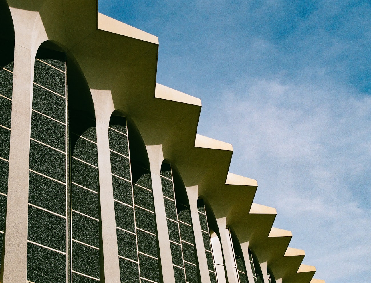 A Tulsa Art Deco building's angular canopy against a blue sky